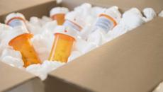 Prescription drug bottles in a box