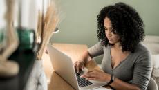 Person with computer at desk