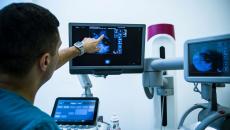 A doctor looking at a mammogram. 