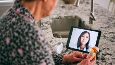 person looking at tablet screen