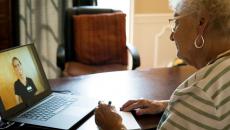 Person talking with nurse on laptop