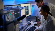 Healthcare providers sitting down and looking at a computer