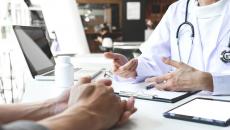 A doctor and patient in a face-to-face consultation